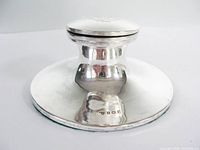 Side view of sterling silver capstan inkwell showing base and hallmark