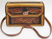 Front view showing tooling pattern, closure and strap