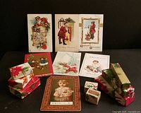 Full lot: seven postcards displayed upright, nesting gift boxes stacked on either side