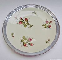 Top view of Rosenthal Moss Rose platter showing pattern and sterling rim