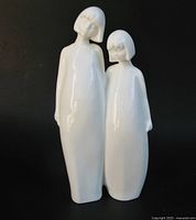 Front view of white porcelain Royal Doulton figurine depicting two girls