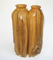 front view of cedar wood vase showing twin columns and artist's natural split design