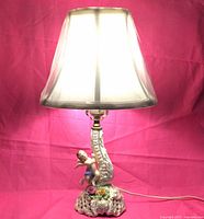 Full view of porcelain lamp with white shade