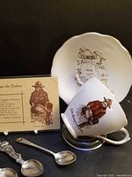 Cup, saucer, postcard and three spoons overview