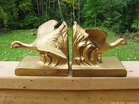 Front view of both gold bookends side by side