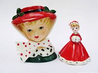 Front view of ceramic Christmas head vase and bell