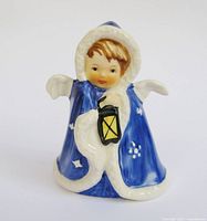 Front view of Goebel porcelain angel with lantern