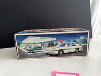 Side panel of Hess Patrol Car box showing illustrated patrol car at fuel station