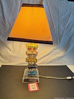 Full view of lamp with shade, power cord visible