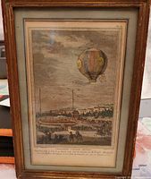 Full view of framed print under glass