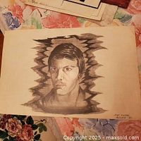 Full view of pencil portrait drawing showing subject and abstract border