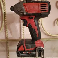 Left side view of Milwaukee M18 drill showing overall condition