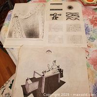 Overview of three artworks on table