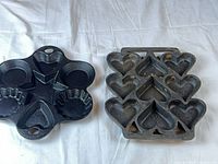 Both cast-iron pans side by side for scale and shape comparison