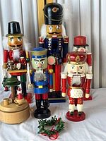 Group shot of five nutcrackers, music box, and wreath