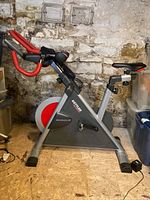 Side view of Kettler Ergoracer GT bike showing frame, flywheel and handlebars