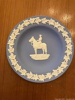 Front view showing relief design, maple leaf border, and dates