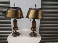 Frontal view of both lamps showing design and overall condition
