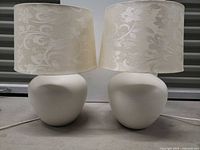 Both matching ceramic lamps with shades shown front view