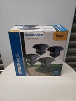 Front of sealed box showing Uberhaus branding, image of four lights, Solar marking