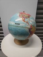 Front view of globe displaying Maclean's logo and Pacific region