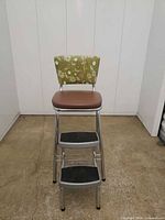 Front view showing chair, seat, backrest, steps down