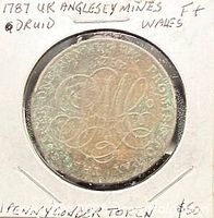 Obverse view displaying monogram and legend