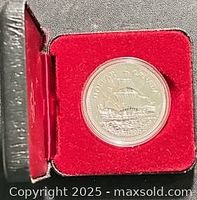 Coin in red-lined presentation case