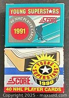 Front view of both 1991 (teal box) and 1990 (red/blue box) Score Young Superstars card sets