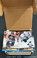 Open box showing two Wayne Gretzky cards on top