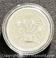 Reverse of 2000 Canadian silver proof quarter in capsule showing celebration design