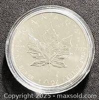 Reverse side showing maple leaf design and purity .9999 silver