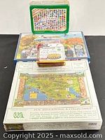 Stack of several unopened puzzle boxes