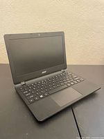 Front view of Acer laptop open, screen and keyboard visible
