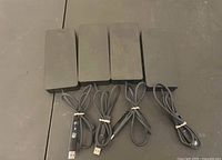 Four Dell docking stations with bundled USB cables