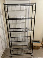 Front view of five-tier black metal wire shelving unit