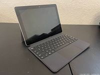 Surface Go tablet with keyboard connected, side view showing kickstand
