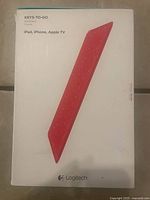 Front of sealed retail box showing Logitech Keys-To-Go red keyboard