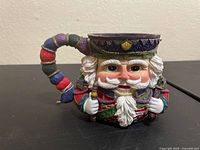 Right side view of Santa Claus mug showing detailed paint and handle