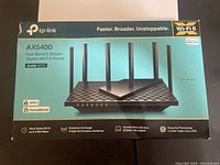 Sealed retail box front showing TP-Link AX5400 Archer AX73 router