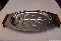 Full view of stainless steel meat dish with Catlin handles