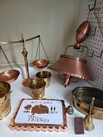 Group shot of all brass and copper items on countertop