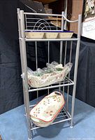 Full view of rack with ceramics on shelves