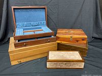 Group shot of five wooden jewelry/flatware boxes