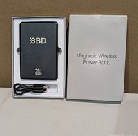 Power bank in open box with BBD logo and cable