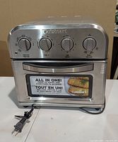Front view of Cuisinart compact air fryer toaster oven showing controls and power cord