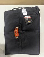 Front view of folded Dickies 874 pants showing tags and size