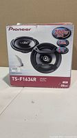 Front of sealed Pioneer TS-F1634R speaker box showing model, power and size