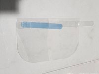 Single clear face shield showing shape and blue forehead strip