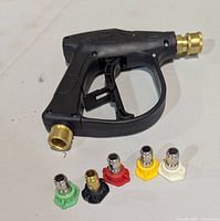 pressure washer spray gun with five quick-connect nozzle tips displayed